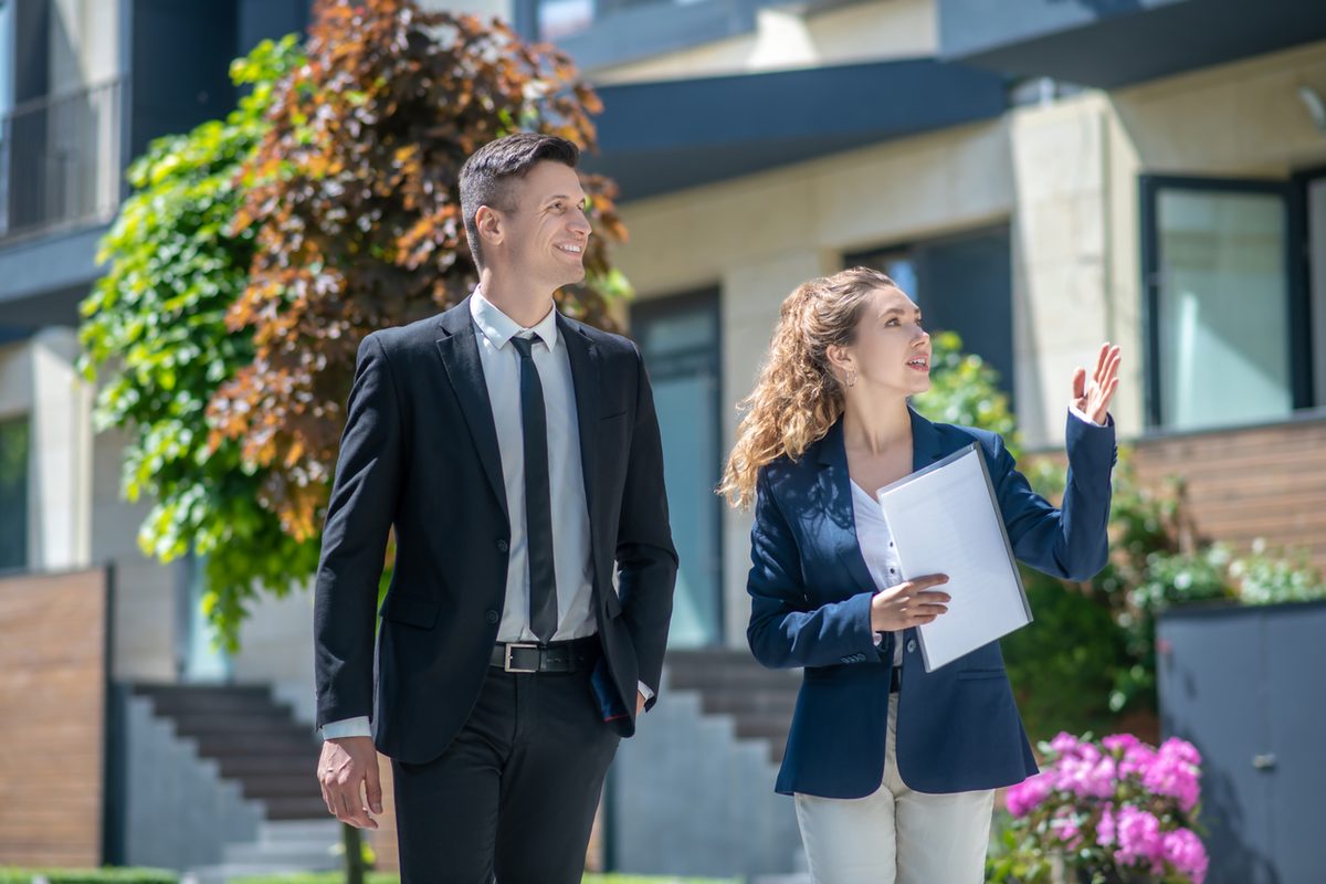 Real estate agent showing property